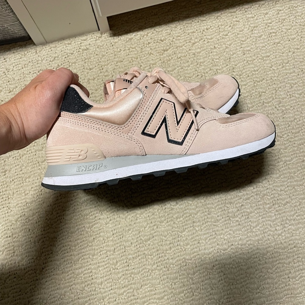 New Balance 574 blush color with black glitter accent